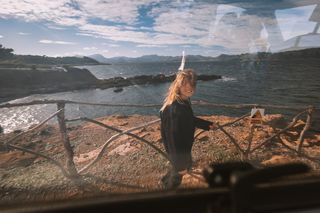 Young woman on the coast in Mallorca in fall