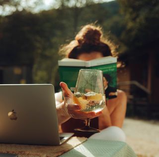 Girl working while Camping 