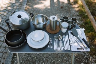 camping table with kitchen utensils