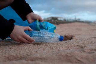 Collecting garbage on a beach