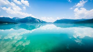 Clear waters of Lake Walchensee with mountains in the background