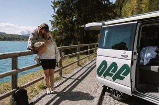 Friends embrace each other at Walchensee on the lakeshore