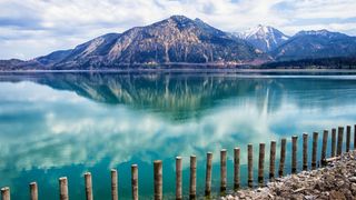 Fence on the shore of Walchensee with mountain backdrop